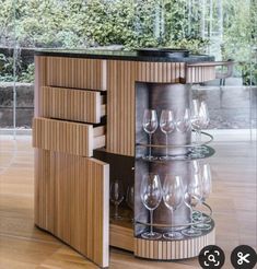 a wine cabinet with many glasses in it