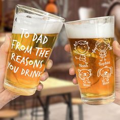 two people holding up beer glasses that say, to dad from the reason you drink