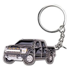 a black and white truck keychain on a white background