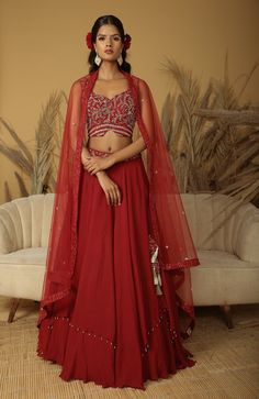 Featuring a maroon layered lehenga in georgette crepe base with embroidery. It is paired with a matching georgette blouse and a net dupatta. Maroon Blouse Lehenga, Semi-stitched Red Georgette Choli, Red Embroidered Georgette Lehenga, Maroon Red Lehenga, Plain Maroon Lehenga, Bridal Shower Cocktails, Georgette Blouse, Lehenga Saree, Net Dupatta