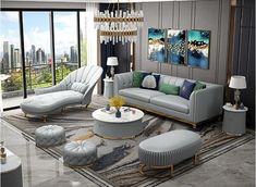 a living room filled with lots of furniture and large windows overlooking the cityscape