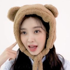 a young woman wearing a bear hat and scarf on top of her head with the caption, dayeon