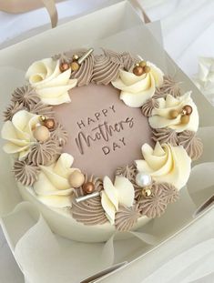 a birthday cake with white frosting and flowers on it