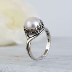 Unique round White Pearl Ring, Made of Silver, Round Shaped, Fashion Jewelry for Women, Handmade By AditaGold.  This beautiful handmade  white pearl ring is made of silver and is carefully handcrafted at my workshop in Israel. Pearl is June's birthstone, and this pearl promise ring will be perfect for any occasion. It is classic and elegant and will add a beautiful sparkle to every day look.  Item details   * Material: Silver * Ring Shank Type: Split * Ring Setting: Bezel * Band Color: Silver * Pearl Promise Rings, Pearl Ring Design, Natural Pearl Ring, Vintage Boho Style, White Pearl Ring, Silver Pearl Ring, Antique Jewellery Designs, Gold Pearl Ring, Expensive Jewelry Luxury