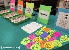 the table is set up with cards and place mats for each student to write their name