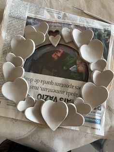 the paper hearts have been cut out to make a wreath