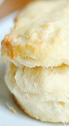 two biscuits sitting on top of a white plate