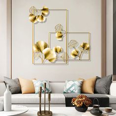 a living room with white couches and yellow flowers on the wall above them is a coffee table