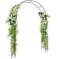 an arch decorated with flowers and greenery