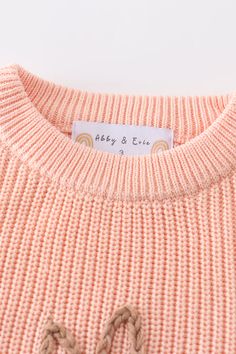 Hop into style with our Coral Hand-Embroidery Bunny Pullover Sweater. This playful top features a cute bunny design hand-embroidered on a soft coral fabric. Perfect for adding a touch of whimsy to any outfit. (Hoppin' good fun without compromising on style!) 100%COTTON 700056 Playful Knitted Tops For Spring, Playful Knitted Crew Neck Top, Cute Embroidered Knit Tops, Cute Cotton Soft Knit Sweater, Pink Crew Neck Top With Bunny Design, Cute Crew Neck Sweater With Ribbed Cuffs, Cute Long Sleeve Knitted Top, Playful Pink Crew Neck Sweater, Cute Long Sleeve Orange Top