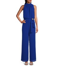 From Marina&#x2C; this jumpsuit features: chiffon fabricationhalter mock necksleevelessbow at waist with rhinestone detaillinedcenter back zip closureapprox. 59" from shoulder to hem polyesterhand washImported. Blue High-rise Jumpsuits And Rompers With Button Closure, Blue Non-stretch Solid Color Jumpsuits And Rompers, Chiffon Jumpsuit, Rhinestone Bow, Dillard's, Mock Neck, Jumpsuit, Chiffon, Clothes