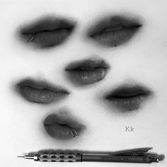 black and white photograph of lips with pen