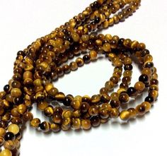 Tiger Eye Gemstone Beads - 15inch Full strand - Round Gemstone BeadsColor : Tiger EyeSize : 4 mm / 6 mm / 8 mm /10 mm / 12 mm DiameterHole : 0.8 mm / 1 mm / 1.3 mm / 1.7 mm / 2 mmShape : Round / FacetedCondition : NewLength : 15 inch strand Quantity : 1 Full Strand4 mm = 85-90 beads6 mm = 55-58 beads8 mm = 46-48 beads10 mm = 35-38 beads12 mm = 30-32 beads//////////////////////////////////////- Please feel free to contact me with any questions or requests.- Hope you find something you like in my Brown Round Beads For Jewelry Making, Brown Gemstone Beads Cabochons, Brown Gemstone Beads And Cabochons, Brown Gemstone Beads Round Cabochons, Tiger Eye Gemstone, Long Holiday, Tigers Eye Gemstone, Heishi Beads, Shell Beads