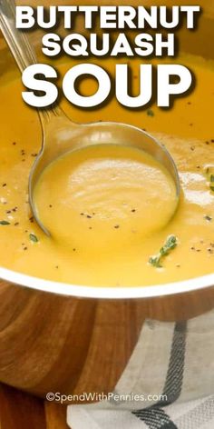 butternut squash soup in a white bowl with a spoon