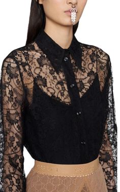 This distinctive black GG lace shirt by Gucci is decorated with a beautiful floral motif. Includes a removable camisole that can be worn alone or combined for a stylish look.Black lace with floral motifDetachable camisolePoint collarFront button fasteningComposition: silk 24%, acetate: 76%Dry cleaningMade in Italy Chevron Outfit, International Clothing, Printed Silk Shirt, Luxury Women Fashion, Elegant Shirt, Paco Rabanne, Lace Shirt, Pink Silk, Silk Shirt