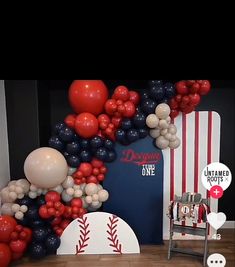 balloons and baseballs are on display in the room