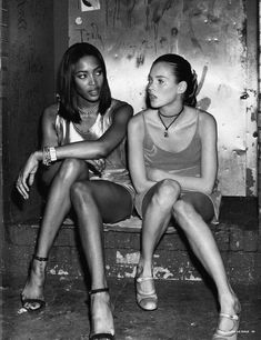 two young women sitting next to each other