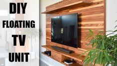 a flat screen tv mounted to the side of a wooden wall with text overlay reading diy floating tv unit