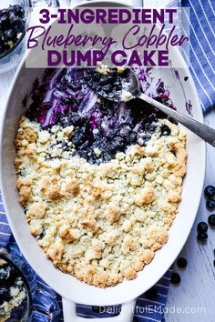 blueberry cobbler in a white bowl with spoon