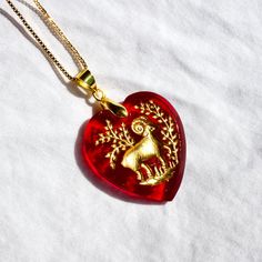 This necklace is composed of an 18k gold plated box chain with a vintage carved 30mm heart shaped stone originating from western Germany and made in the 1950s. Necklace is 18" with a 4cm extension chain. Tarnish resistant, lead and nickel free! Extremely unique and beautiful item - once out of stock, there will be no more! Vintage Metal Heart Necklace, Spiritual Heart-shaped Necklace With Vintage Charm, Vintage Heart-shaped Charm Necklace, Vintage Heart-shaped Charms Necklace, 1950s Necklace, Vintage Red Heart-shaped Necklace, Vintage Zodiac, Mythology Jewelry, Fork Jewelry