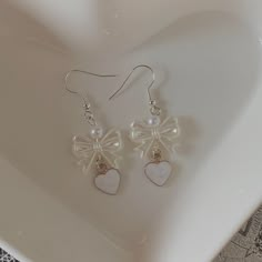 ୨୧ bow earrings with a faux pearl and heart! ୨୧ ✧.* jewelry care tips: - keep away from water/moisture. - remove when sleeping. - avoid initial contact w/ perfume and lotion. - clean using a dry, soft cloth.  ✧.* please note that after your package is shipped, i am not responsible for any damages/shipping issues that may occur.  ✧.* thank you for shopping with me! please don't hesitate to contact me with questions or concerns. Coquette Earrings, Kawaii Fairycore, Perfume And Lotion, Coquette Jewelry, Earrings Y2k, Soft Accessories, Y2k Kawaii, Earring Stack, Paper Ring