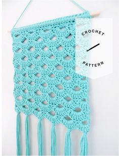 a crochet pattern hanging on a wall