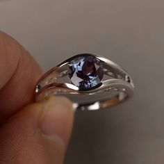 This is a gorgeous handmade creation. Its beauty is its simplicity & Elegance. The 7*7mm round shape faceted lab alexandrite is crafted in solid sterling silver and with rhodium plated. All item is sent in a beautiful gift box If you have any idea of design your ring,pls contact me directly. You can realize more lovely stuff clicking the link https://www.etsy.com/shop/knightjewelry?refshopsection_shophome_leftnav Please leave the correct address and you phone number for delivering successful Elegant Tanzanite Birthstone Ring For Promise, Formal Crystal Ring With Birthstone In Round Cut, Elegant Amethyst Birthstone Ring With Round Stone, Brilliant Cut Amethyst Ring In Sterling Silver For Promise, Amethyst Ring In Brilliant Cut Sterling Silver For Promise, Elegant Silver Crystal Ring With Birthstone, Sterling Silver Amethyst Ring With Brilliant Cut For Promise, Formal Silver Crystal Ring With Birthstone, Elegant Silver Crystal Birthstone Ring