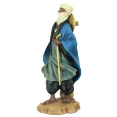 a figurine of an old man with a cane and blue robe on his head