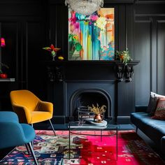 a living room with black walls and colorful rugs on the floor next to a fire place