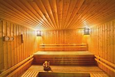 a wooden sauna with benches and lights