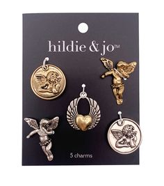 six charms with angels and cherubs on them in gold, silver or bronze