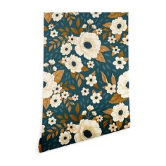 a blue and white flowered wallpaper with gold leaves on the bottom half of it