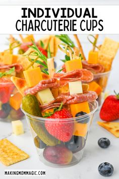 an individual charcuterie cups with fruit, cheese and crackers in it is the perfect appetizer for any party