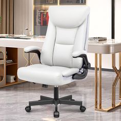 a white office chair sitting in front of a desk