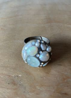 Opal, Aquamarine, Pearl and Swarovski Crystal Ring.  Stones are set into Swarovski Crystal Clay, in a white brass adjustable bezel set ring. Ring is a size US 7 and can be adjusted up. Band is antiqued, but is modern. Stones are all Vintage and Antique. See photos. Ring Stones, Swarovski Crystal Rings, Opal Band, Portland Me, Bezel Set Ring, White Brass, Buddha Pendant, Aquamarine Ring, Set Ring