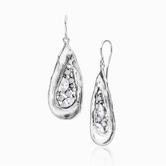 Add a bold statement and an artistic charm to your style with these unique sterling silver CZ shield earrings. Versatile and chic, these dangle earrings feature a mix of marquise and round cubic zirconia stones for a sparkly touch. Pair them with your favorite tee and blazer and you'll be sure to stand out in any crowd. Each piece is individually handcrafted with lots of love and special attention to detail. DETAILS:  * Metal: sterling silver * Marquise CZ size: 3x6mm each * Round CZ size: 2.5mm each * Total carat weight: 4.4 ct. * Sold as a pair.  PROCESSING TIME & SHIPPING:  Processing time: 3-5 business days  Your order will be on its way to you within a few business days. Once your order has shipped, we will update you with your tracking number. Check your order on Etsy or confirmation Sterling Silver Dangle Earrings, French Wire, Cz Earrings, Earrings Unique, Silver Shop, Girl Shower, Earrings Statement, Silver Earrings Dangle, Earrings Sterling Silver