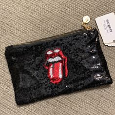 Super Sparkly And Adorable Rolling Stones Pouch In Black. It Has The Red Rolling Stones Logo On The Front, A Zip Top Closure, And A Small Zipper Pocket Inside. Carry Your Makeup In It, Or Use It As A Fancy Clutch For A Rockin Night Out. Nwt! Approx. 5.5” Tall By 9” Wide. Trendy Red Pouch, Black Party Bag With Zipper Pouch, Fancy Clutch, Rolling Stones Logo, Sequin Bag, Rolling Stones, Zipper Pocket, Inside Pocket, Night Out