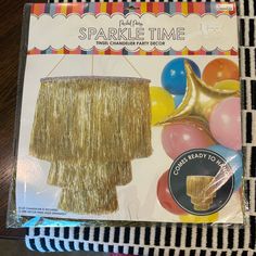 a party decoration kit with gold fringe and balloons