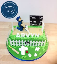 a cake made to look like a field with a baseball player on it and a sign that says total 100 wts over 13