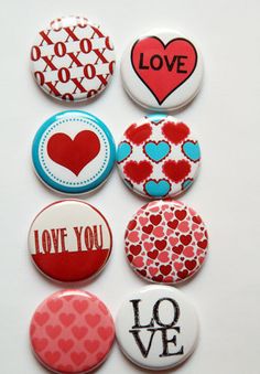 six buttons with different designs on them and the words love are in red, white, and blue