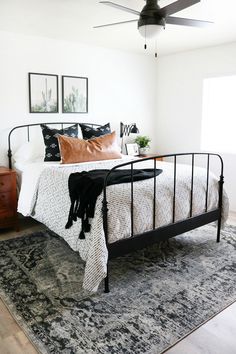 an instagram photo of a bed with pillows and blankets on top of the bed