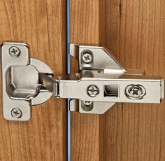 an image of a wooden door with metal latch