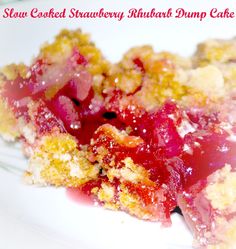 a slice of strawberry rhubarb dump cake on top of a white plate