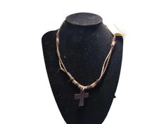 This necklace is made of leather and rope, with the cross being wood. It measures 18 inches long. The cross measures 1 inch wide by 1.5 inches long. It is new old stock and still has the tag. Necklace Rope, Snowflake Pendant, Beaded Cross, Black Rectangle, Gold Tone Necklace, Amethyst Necklace, Agate Gemstone, Gemstone Necklace, Pendant Necklaces