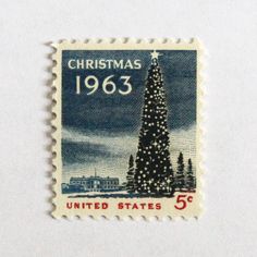 a stamp with a christmas tree on the front and bottom, which reads united states 5 cents