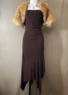 "Fun faux fur topper goes from day to night seamlessly: wear it with jeans and a sweater for day, or pair it with a disco dress or glam gown for evening. Warm caramel with deeper brown accents, cap sleeve, open front, fully lined, it makes a bold statement worn with any look! Purchased in 2015, this is the first time it has been listed for sale. MEASUREMENTS  Bust up to 34\" Length 15\" Fits a modern size XS to S. No labels. Outer shell: faux fur. Lining: solid brown satin fabric. In very good c Winter Party Fitted Shrug, Chic Shrug For Night Out, Chic Fitted Shrug For Night Out, Fitted Evening Shrug For Fall, Chic Evening Winter Shrug, Fitted Faux Fur Party Outerwear, Fitted Faux Fur Outerwear For Party, Winter Evening Fitted Shrug, Chic Fitted Winter Shrug