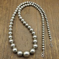 "This is a classy vintage sterling silver graduated bead necklace. The necklace measures 14 1/2\" long. The largest center silver bead measures approximately 5/8\". The smaller beads near the shepherds hook measures 1/4\". This item does not have hallmarks or stamps. The beautiful simple design allows this piece to be styled for every day wear, or for a special occasion. Please feel free to message us if you have any questions. Thank you for shopping with us. ( NECK-10-AV-NK-22" Shepherds Hook, Classy Vintage, Silver Chain Style, Sterling Silver Cuff Bracelet, Copper Bracelet, Silver Bead, Sterling Silver Cuff, Silver Cuff Bracelet, Silver Cuff