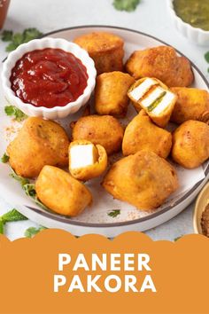 paneer pakora on a plate with ketchup and sauce