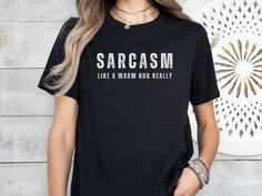 The Bella+Canvas Shirts are so soft. They are one of our favorites. Let your shirt say it all with this "Sarcasm like a warm hug really," T-shirt with distressed lettering. Perfect for anyone with a sense of humor. It's a unisex, buttery soft, jersey short sleeve tee that fits like a well-loved favorite. Soft cotton and quality print make users fall in love with it over and over again. These t-shirts have-ribbed knit collars to bolster shaping. The shoulders are tapered for a better fit over tim Sarcasm T-shirt, Sarcastic Shirts Women Inspire Uplift ⭐, Sarcasm Shirts For Women, Distressed Lettering, Funny Tees Women, Sarcasm Shirts, Tshirt For Women, Funny Tshirt, Warm Hug