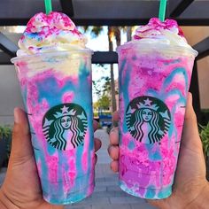 two starbucks drinks with pink and blue swirled toppings